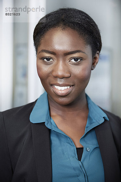 Portrait of young Afro-european business woman