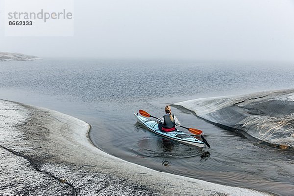 Woman canoeing  Sweden