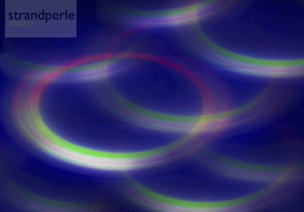 Verschwommenes fluoreszierendes  abstraktes Hintergrundmuster aus Kreisen