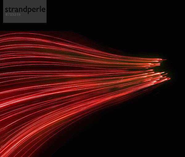 Abstraktes Hintergrundmuster aus leuchtenden roten Glasfaser-Lichtern