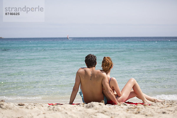Couple Relaxing at Beach  Sardinia  Italy