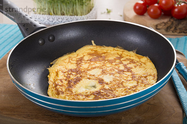 Omelette in frying pan