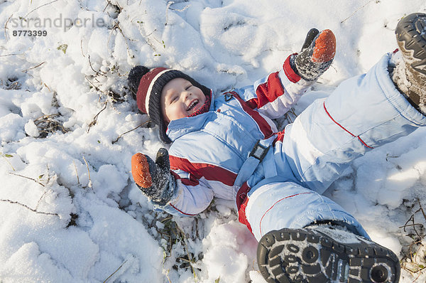 Germany  little boy having fun in snow