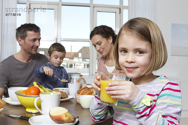 Family of four having healthy breakfast