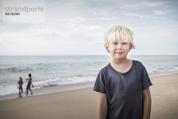 lächeln  Strand  Junge - Person