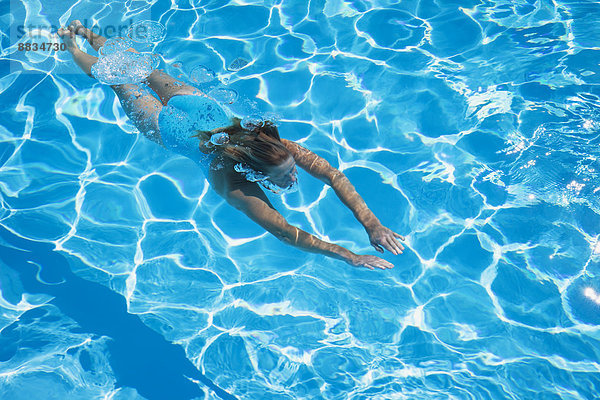 Italy  woman diving in swimmingpool