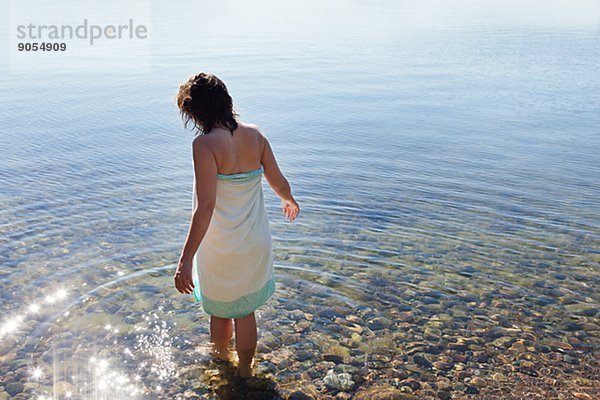 Woman wading in water  Sweden