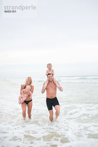 Family with children on beach  Australia