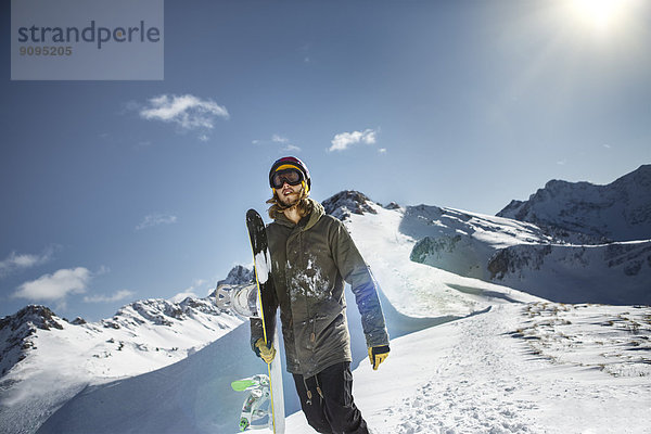 Austria  Vorarlberg  Riezlern  Snowboarder in the mountains