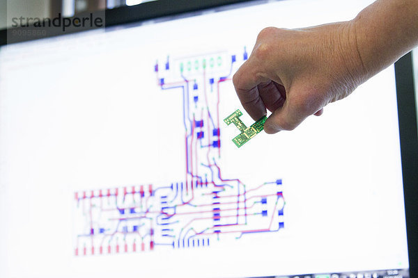 Germany  Hand holding electronic component