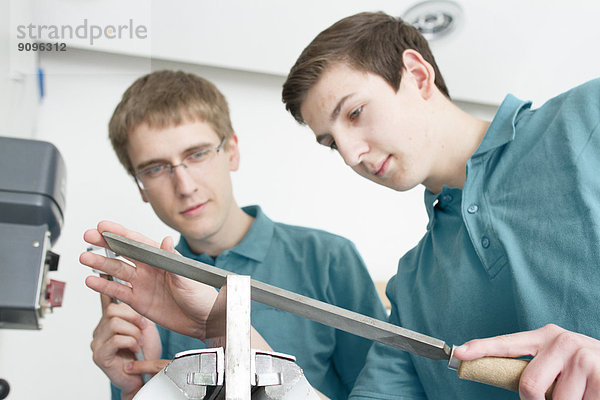 Trainees in a mechanical workshop
