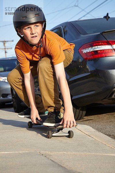 Skateboarden auf dem Bürgersteig