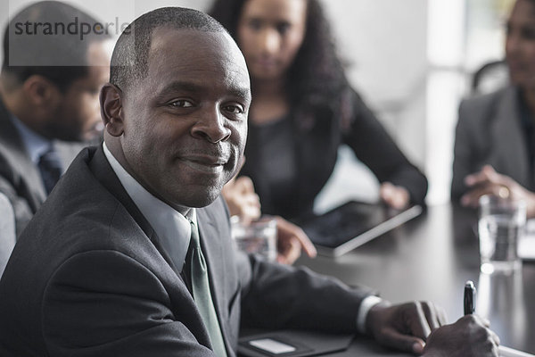 Businessman smiling in meeting