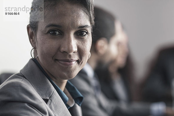 Businesswoman smiling in meeting