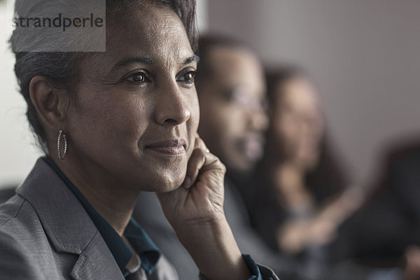 Businesswoman smiling in meeting