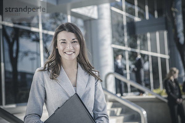 Businesswoman smiling outdoors