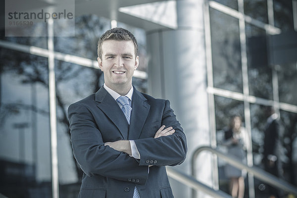 Businessman smiling outdoors