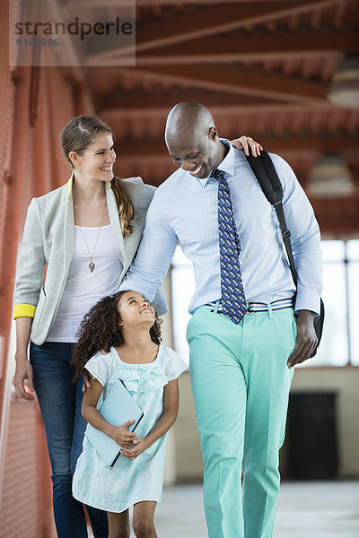 Family walking together on walkway