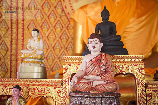 Ornate Buddha statues in temple