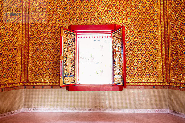 Ornate wall and window in Wat Chayamangkalaram temple  George Town  Penang  Malaysia
