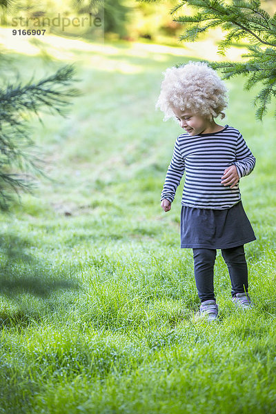 Mixed race girl walking outdoors