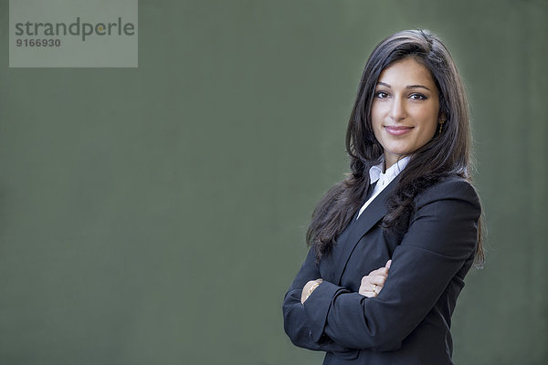 Mixed race businesswoman smiling