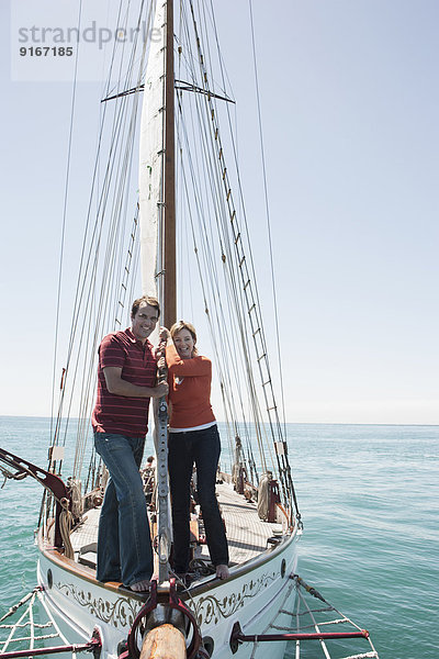 Caucasian couple on sailboat