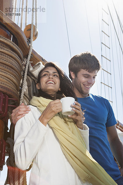 Caucasian couple on sailboat