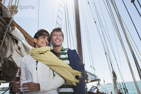 Caucasian couple on sailboat