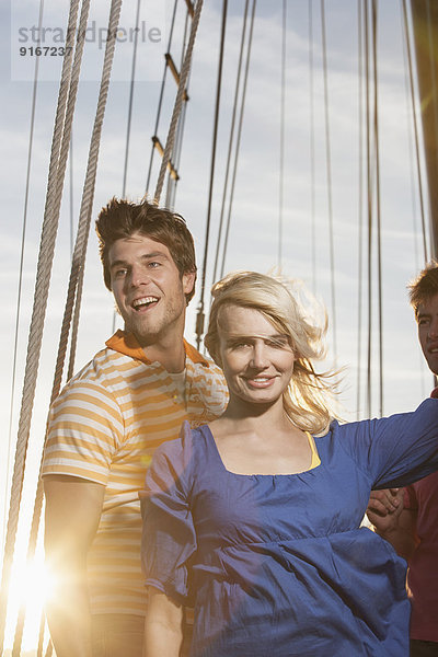 Caucasian friends on sailboat