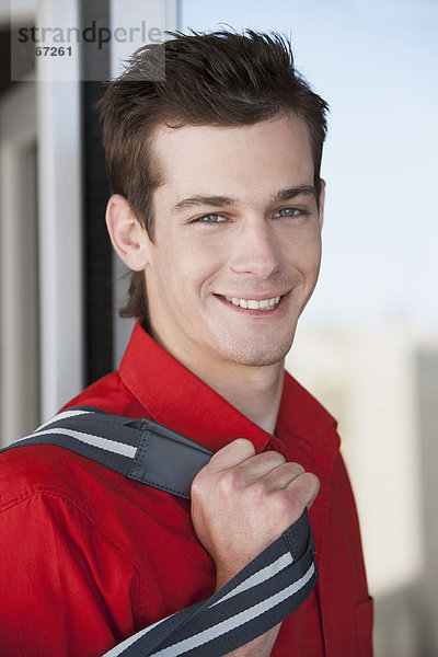 Caucasian man smiling outdoors