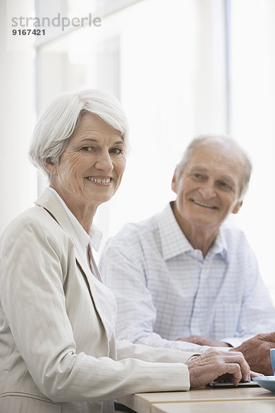 Senior Caucasian couple having coffee in cafe