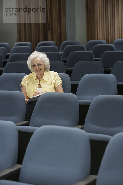 Senior Caucasian student sitting in classroom