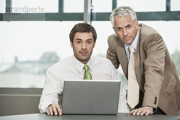 Businessmen working together in office