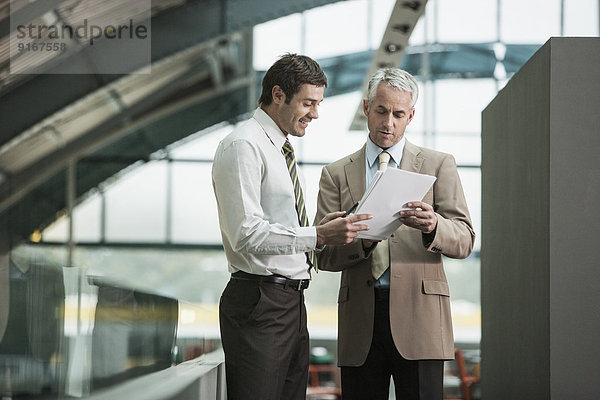 Businessmen talking in office