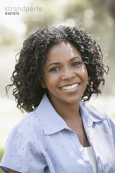 African American woman smiling outdoors