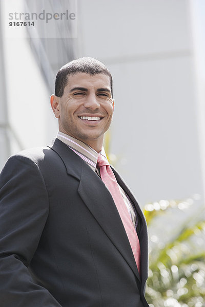 Hispanic businessman smiling
