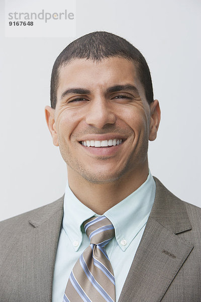 Hispanic businessman smiling