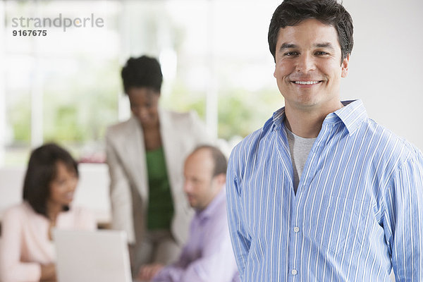 Businessman smiling in office