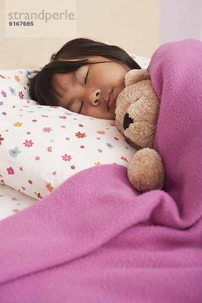 Chinese girl sleeping in bed