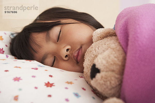 Chinese girl sleeping in bed