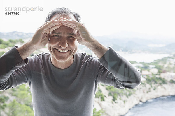 Man peering through window