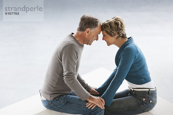 Couple sitting together outdoors