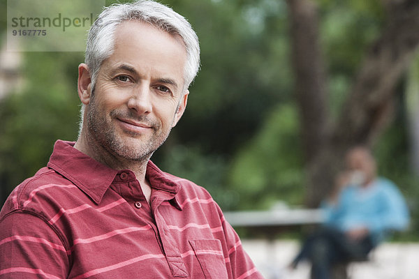 Man smiling outdoors