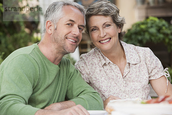 Couple smiling together outdoors