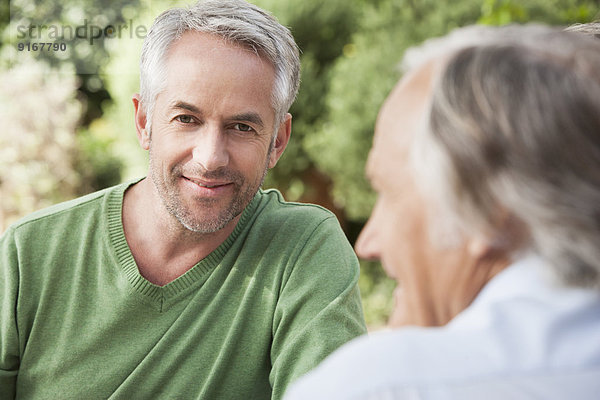 Man smiling outdoors