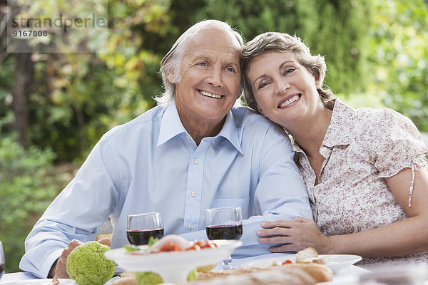 Couple eating together outdoors