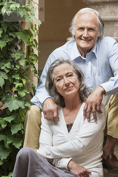 Couple sitting together outdoors