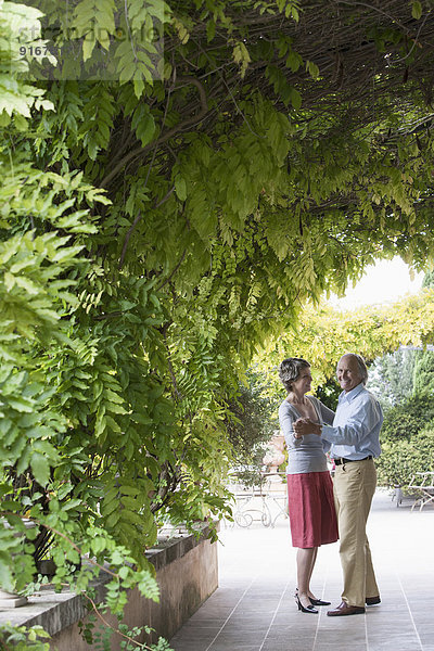 Couple dancing together outdoors