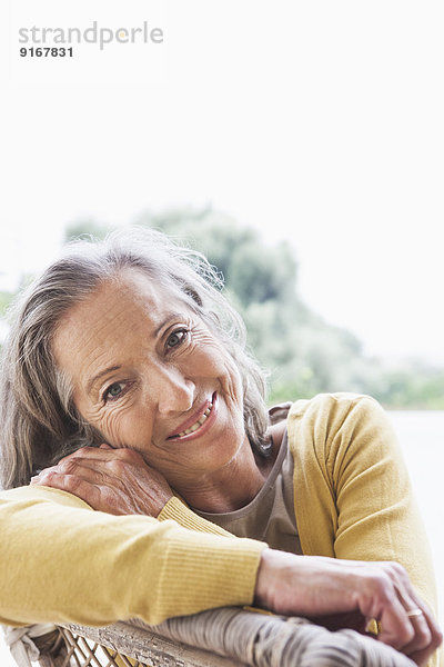 Woman smiling outdoors